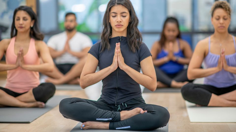 Person in a yoga pose focusing on mindfulness and balance